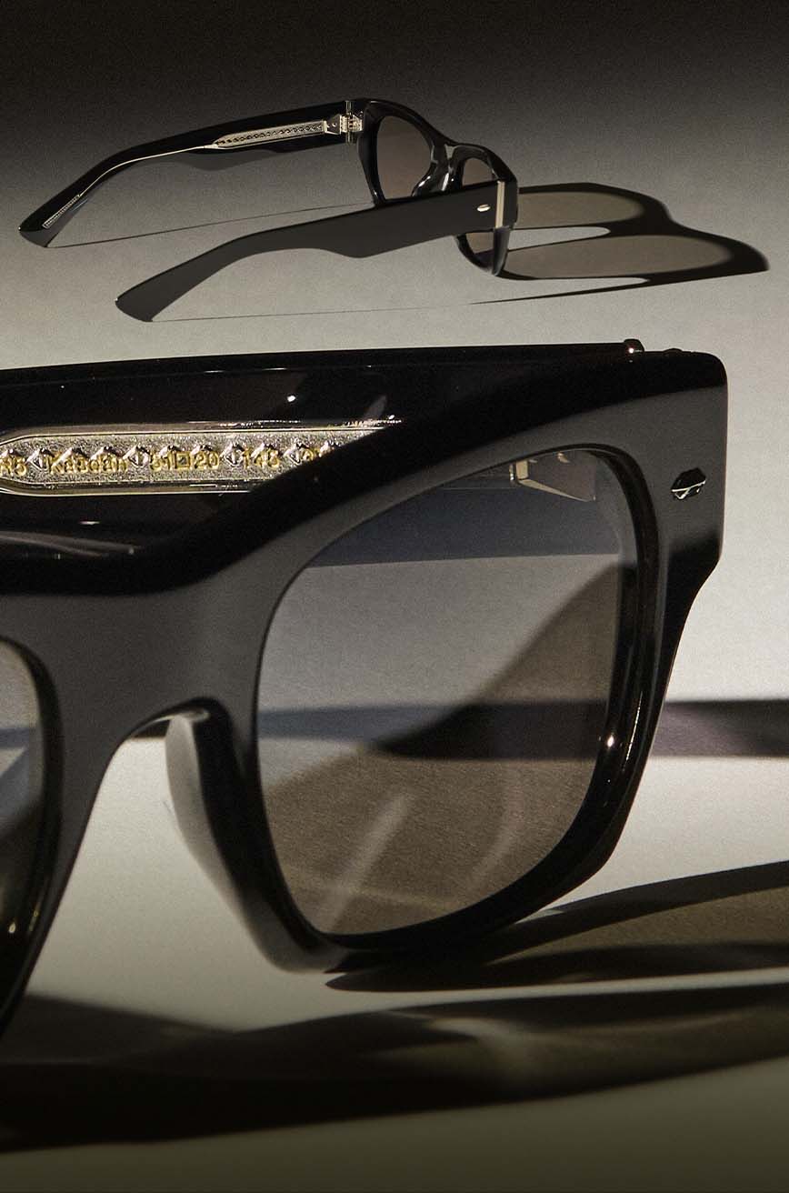 The style is seen with 14k White Gold-Plated detail and glass lenses.