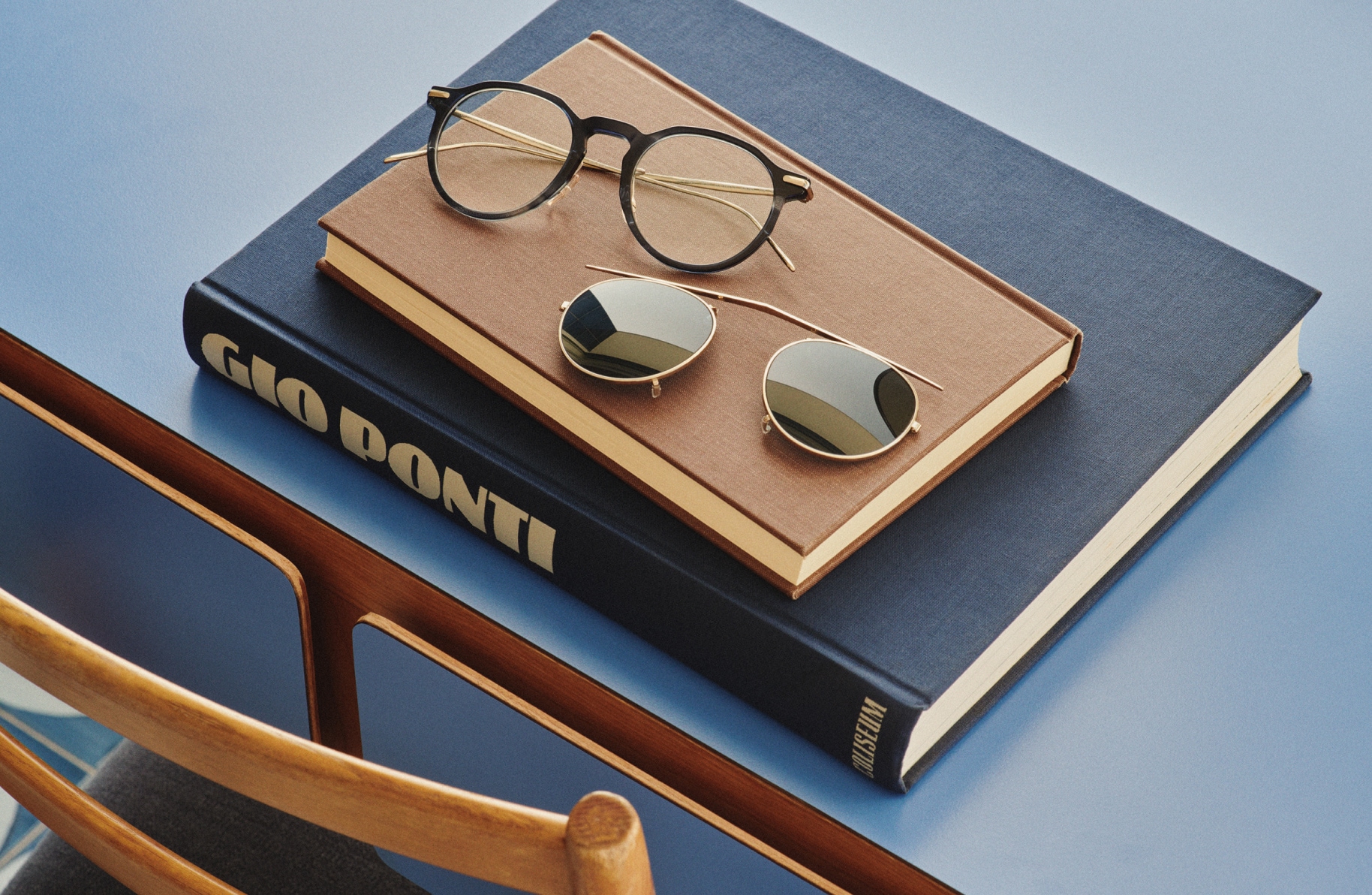 Worn separately or together, the unique frame detail and clip accessory of G.Ponti-1 stands out on top of Gio Ponti designed desk for the Hotel Parco Dei Principi in Sorrento, Italy.